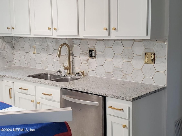 kitchen featuring white cabinetry, dishwasher, and sink