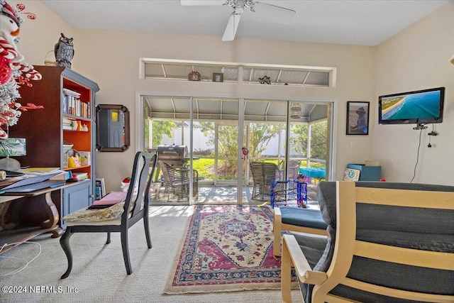 carpeted office space featuring ceiling fan