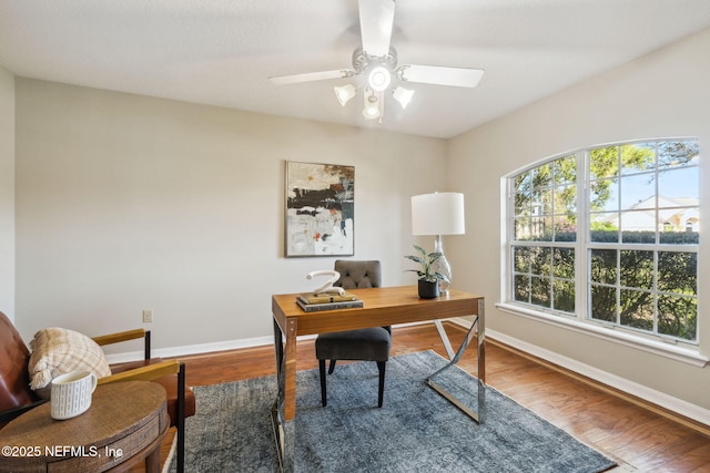 office space featuring hardwood / wood-style floors and ceiling fan