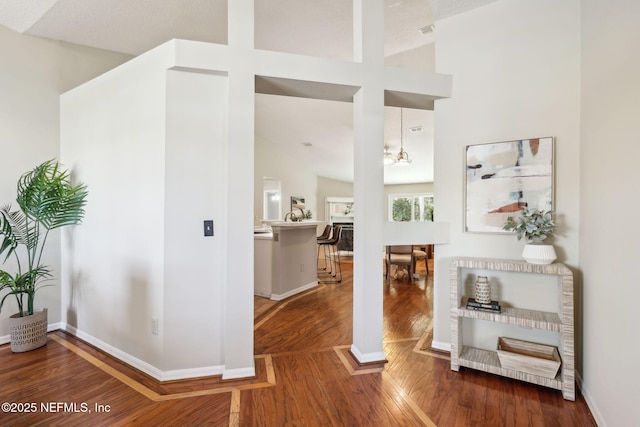 interior space with lofted ceiling and hardwood / wood-style flooring