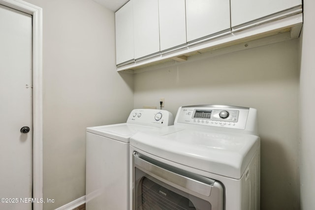 laundry area featuring cabinets and independent washer and dryer