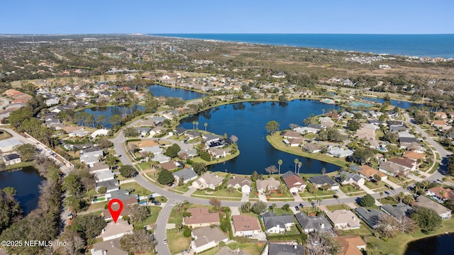 drone / aerial view with a water view