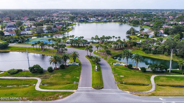 birds eye view of property featuring a water view