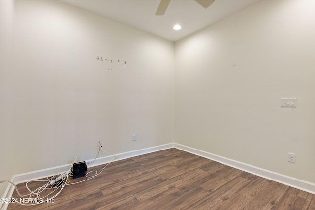 spare room with dark hardwood / wood-style floors and ceiling fan