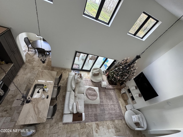 interior space with hardwood / wood-style flooring and high vaulted ceiling