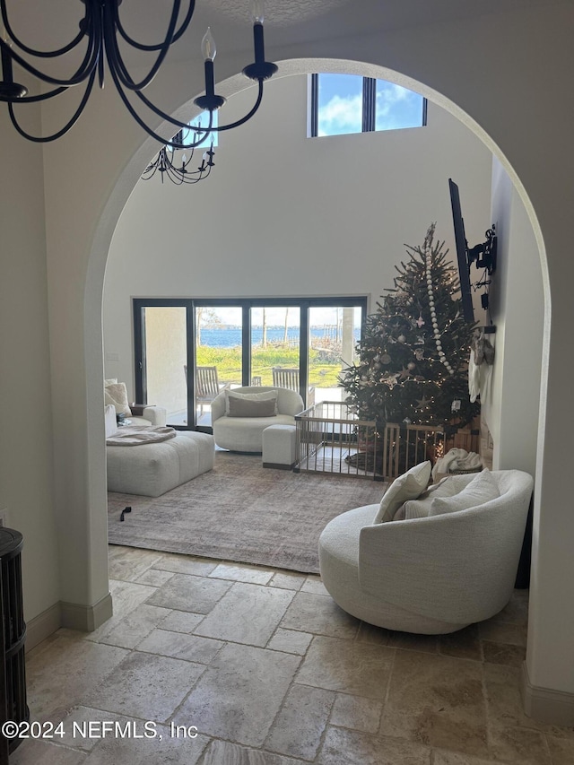 living room featuring a wealth of natural light and a chandelier