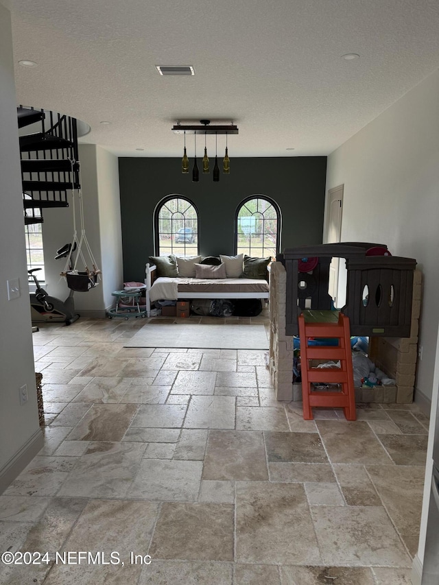 foyer with a textured ceiling