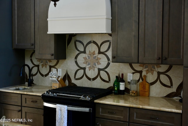 770 River Mist Bnd, Palatka, FL 32177 - kitchen featuring a sink, dark brown cabinetry, light countertops, decorative backsplash, and black range with gas stovetop