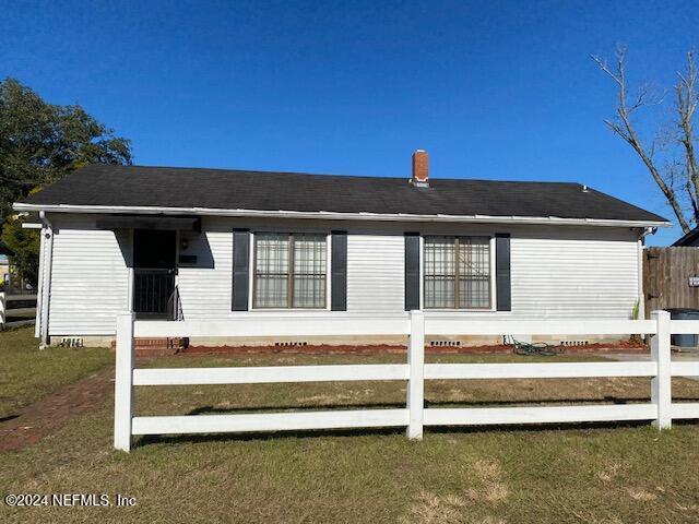 view of property exterior featuring a lawn