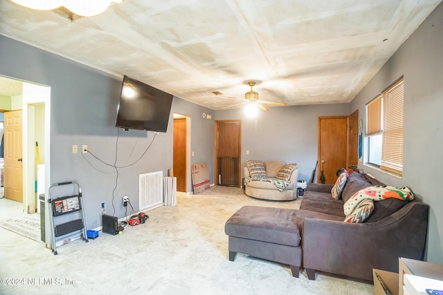 living room with ceiling fan and light colored carpet