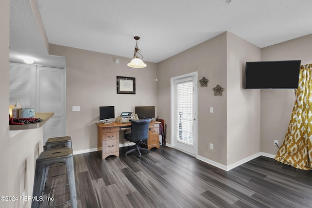 office area featuring a textured ceiling and dark wood-type flooring