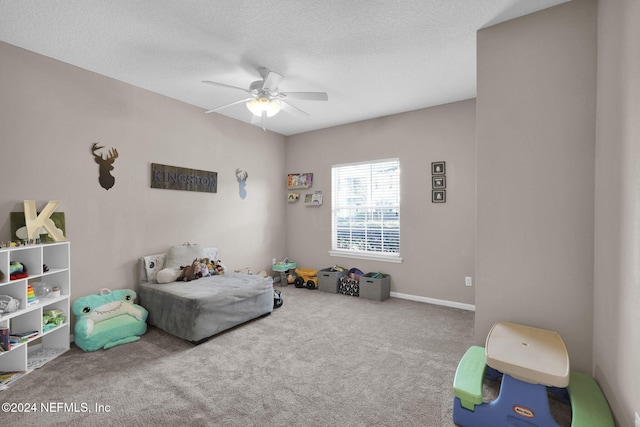 interior space with ceiling fan and a textured ceiling