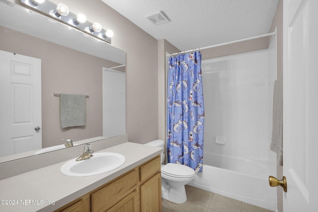 full bathroom featuring tile patterned flooring, shower / bath combination with curtain, a textured ceiling, toilet, and vanity