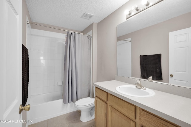 full bathroom with vanity, tile patterned floors, toilet, a textured ceiling, and shower / tub combo with curtain