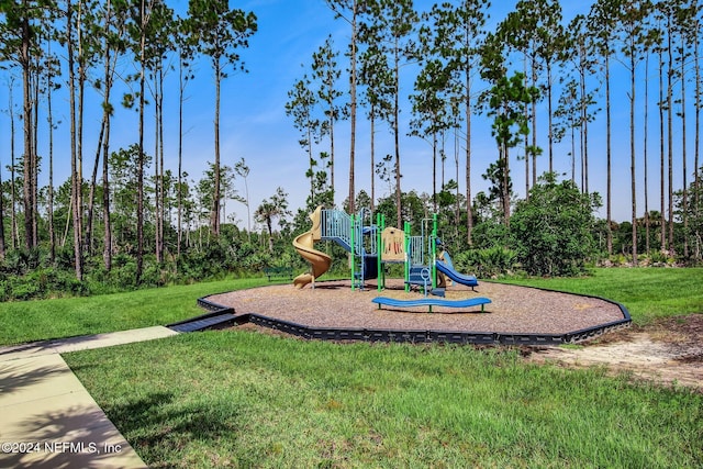 view of playground with a lawn