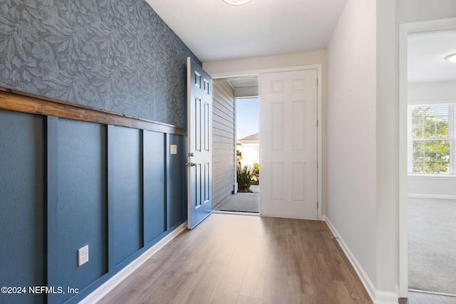 doorway to outside with wood-type flooring