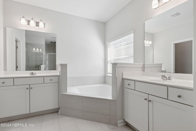 bathroom with separate shower and tub, tile patterned flooring, and vanity