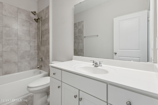 full bathroom with vanity, toilet, and tiled shower / bath