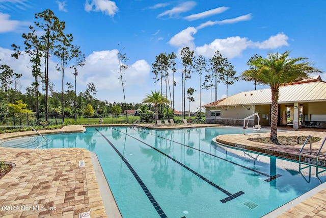 view of swimming pool featuring a patio