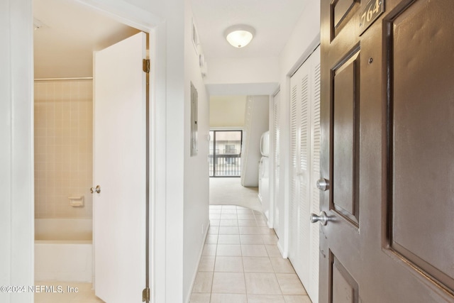 hall featuring light tile patterned floors