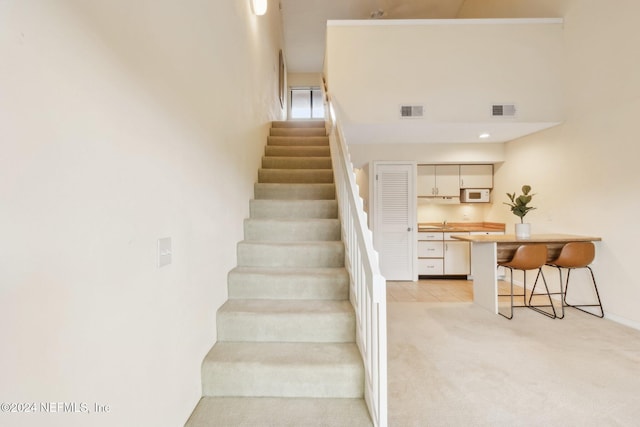 staircase with carpet