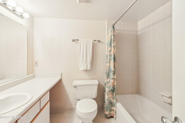 full bathroom with shower / tub combo with curtain, vanity, and toilet