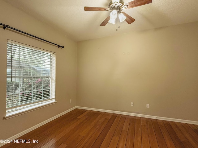 spare room featuring hardwood / wood-style flooring and ceiling fan