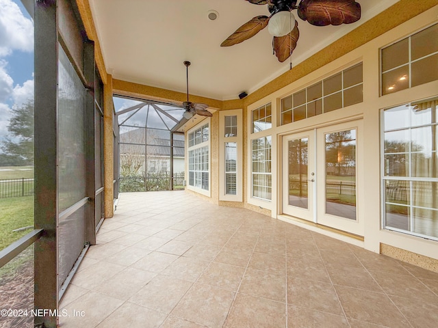 unfurnished sunroom featuring french doors and a healthy amount of sunlight