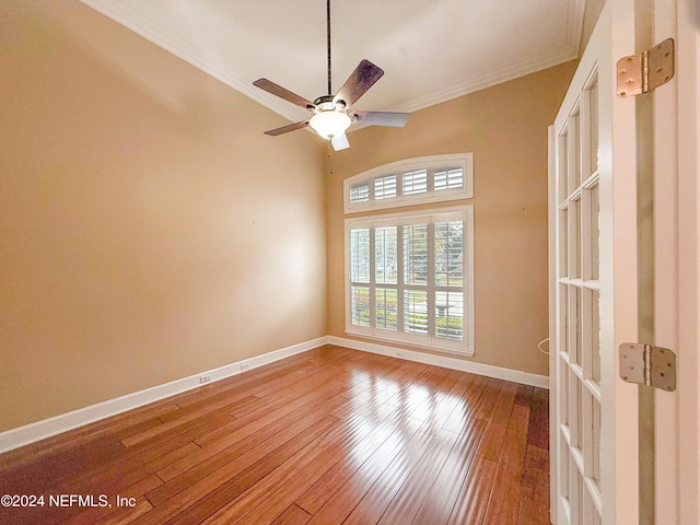 unfurnished room featuring crown molding, hardwood / wood-style floors, and ceiling fan