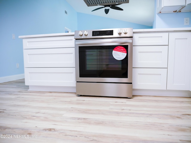 kitchen with ceiling fan, white cabinets, stainless steel range oven, and light wood-type flooring