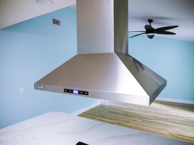 details with ceiling fan and island exhaust hood