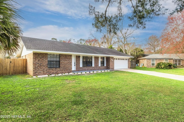 ranch-style home featuring a garage and a front lawn