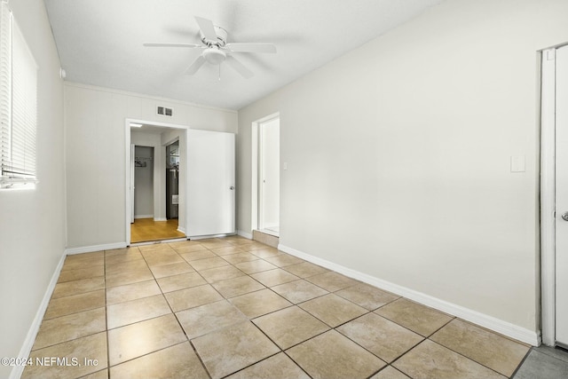 unfurnished bedroom with ceiling fan and light tile patterned flooring