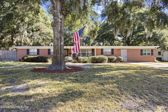 ranch-style home with a front lawn