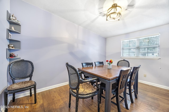 dining room with dark wood-type flooring