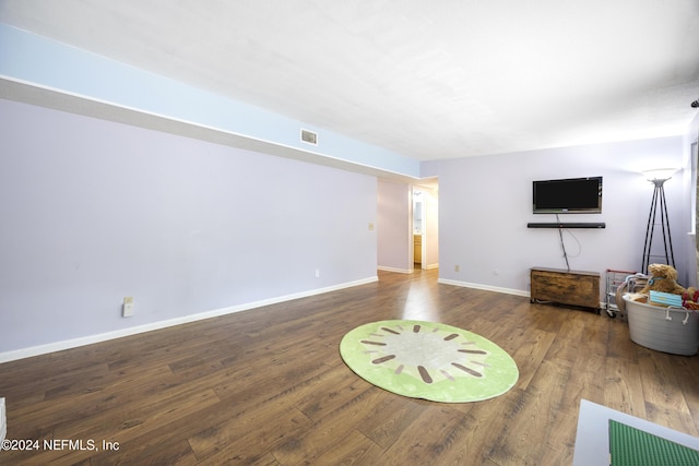 unfurnished living room featuring hardwood / wood-style floors