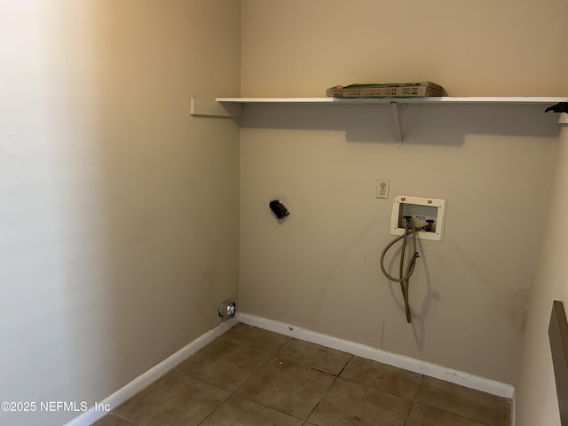 clothes washing area featuring laundry area, washer hookup, tile patterned flooring, and baseboards