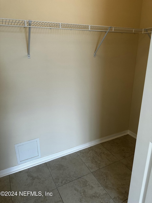 spacious closet featuring tile patterned floors