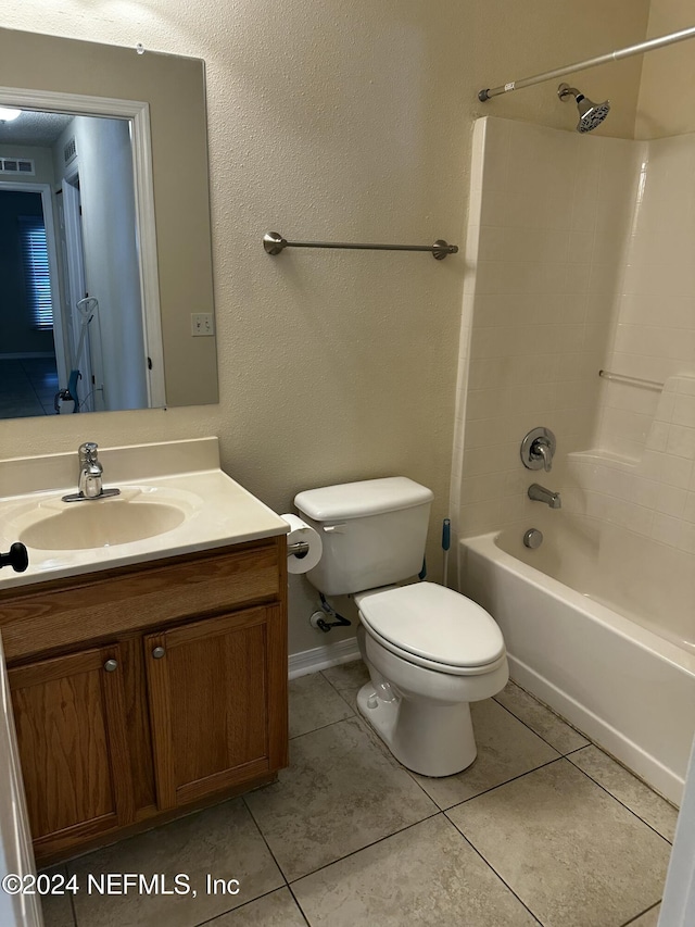 full bathroom featuring tile patterned flooring, vanity, toilet, and bathing tub / shower combination