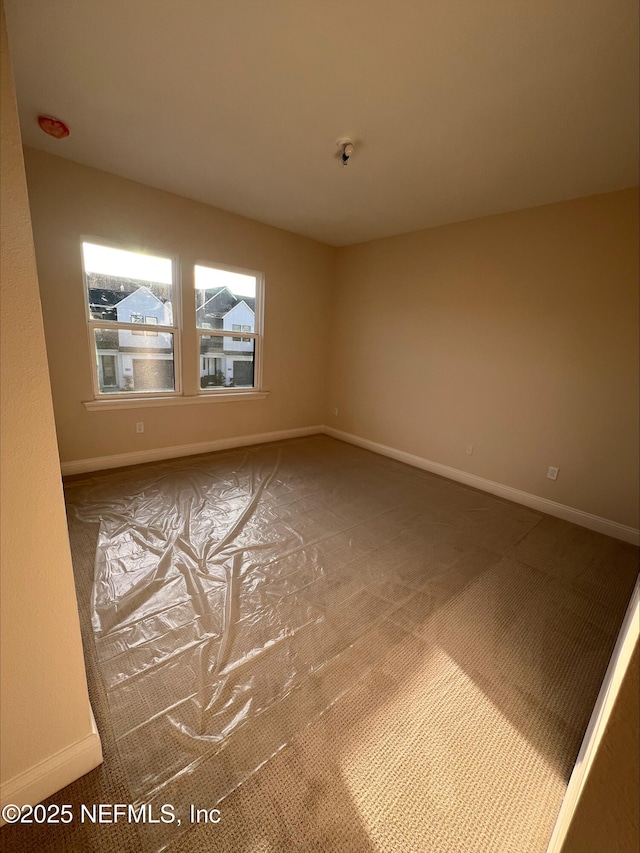 spare room featuring carpet flooring