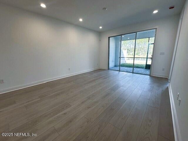 empty room featuring dark wood-type flooring