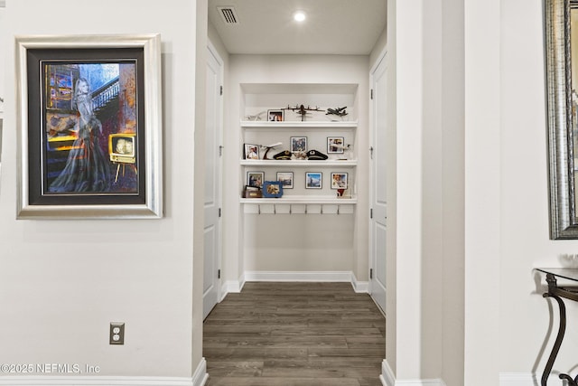 hall featuring dark wood-type flooring