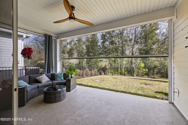 sunroom / solarium with plenty of natural light and ceiling fan