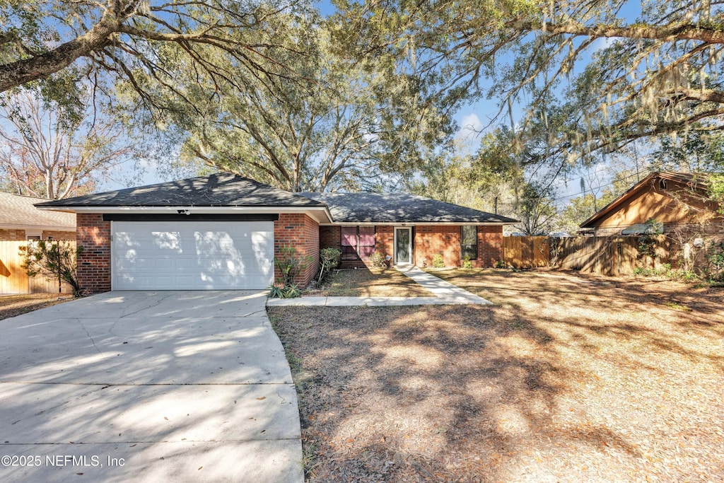 single story home featuring a garage