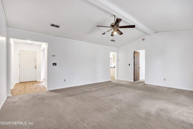 carpeted empty room featuring ceiling fan and vaulted ceiling with beams