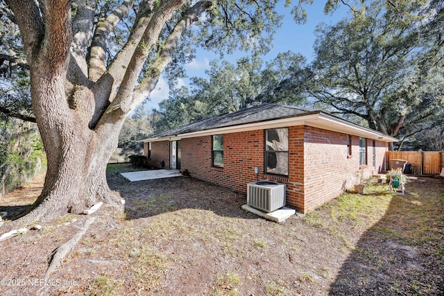 view of home's exterior featuring a patio area and central AC unit