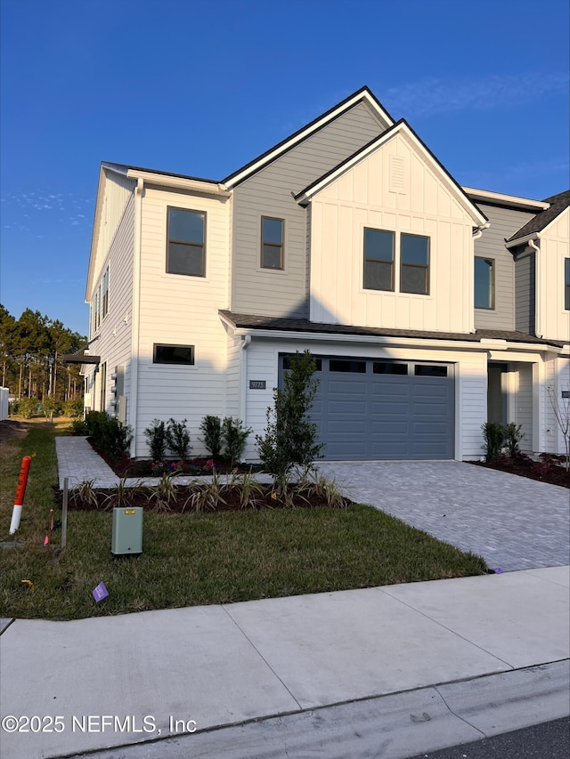 view of front facade with a front lawn and a garage