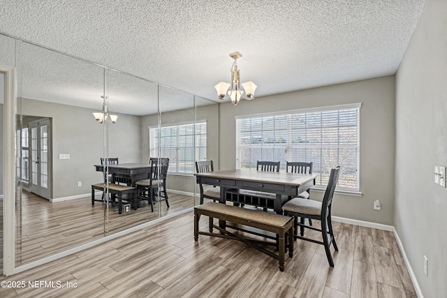 dining area featuring an inviting chandelier