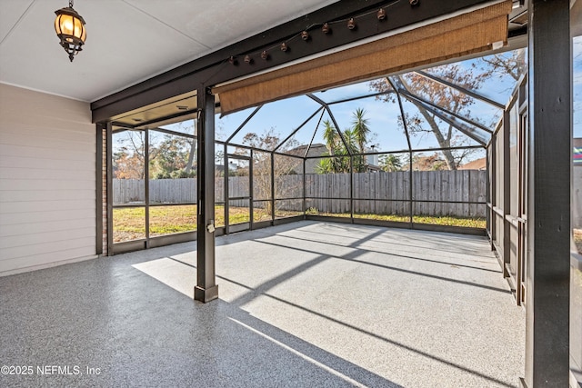 unfurnished sunroom featuring plenty of natural light