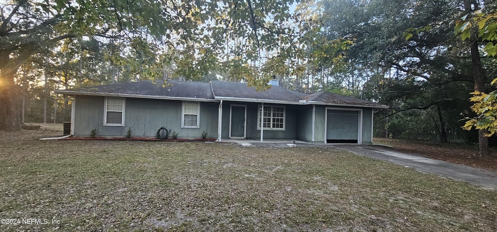 rear view of house with a garage